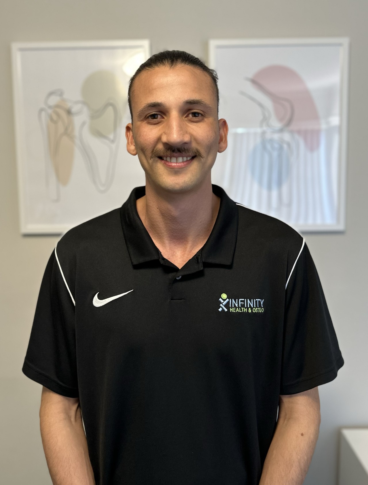 Nicholas, an AHPRA-registered osteopath at Infinity Health and Osteo